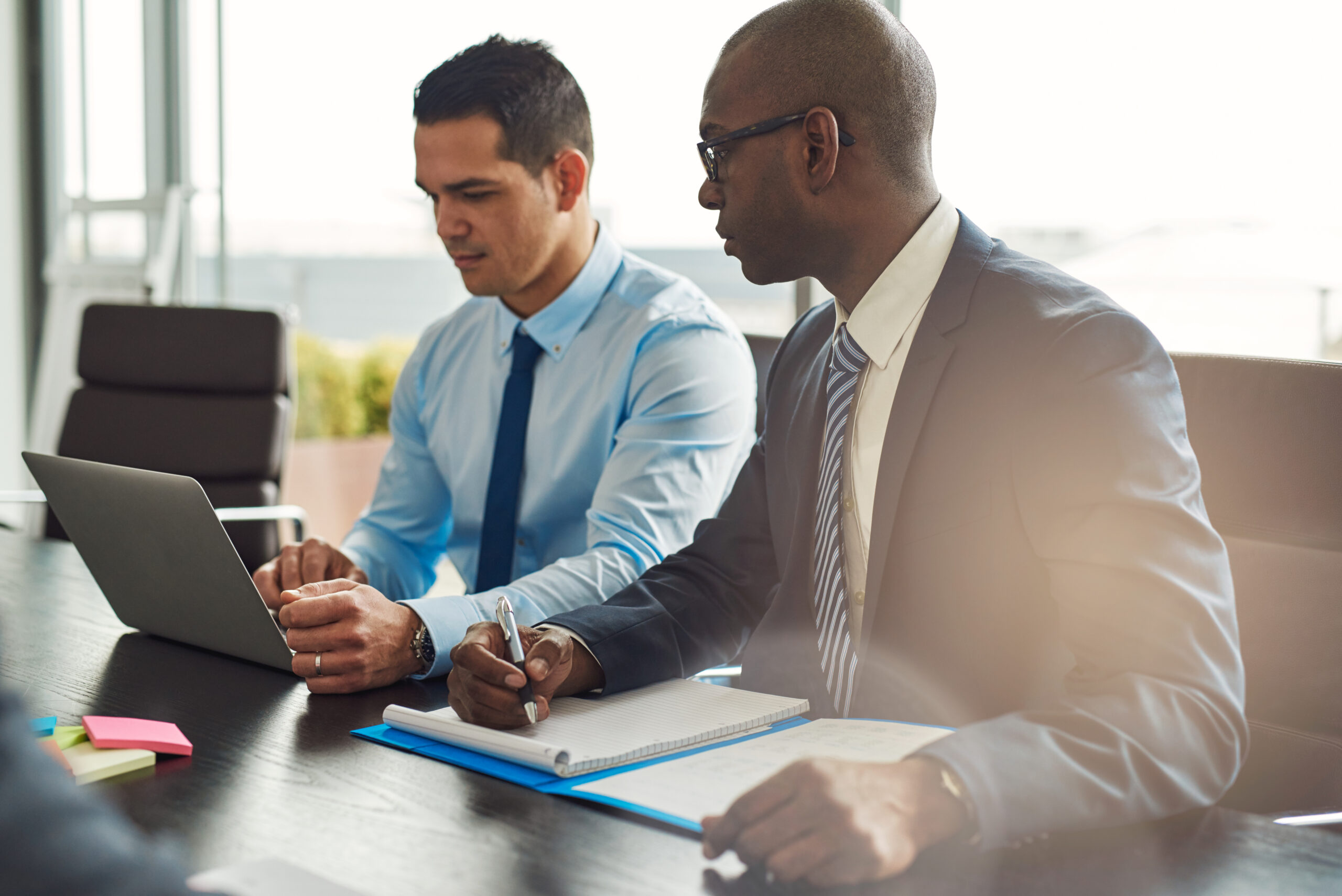 Two,Experienced,Business,Executives,In,A,Meeting,Seated,At,A
